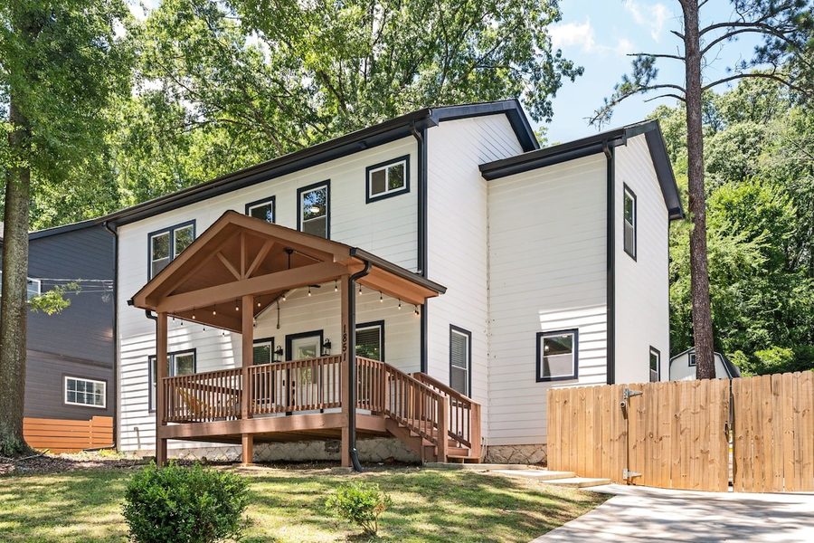 Fire-pit yard with Adirondack chairs and a guest cabin