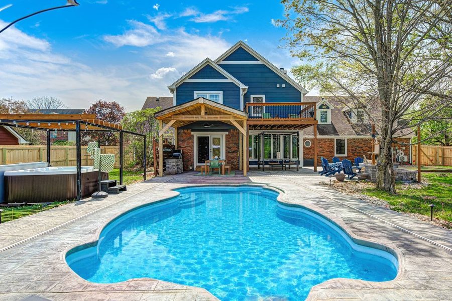 Private pool with lounge chairs and umbrellas