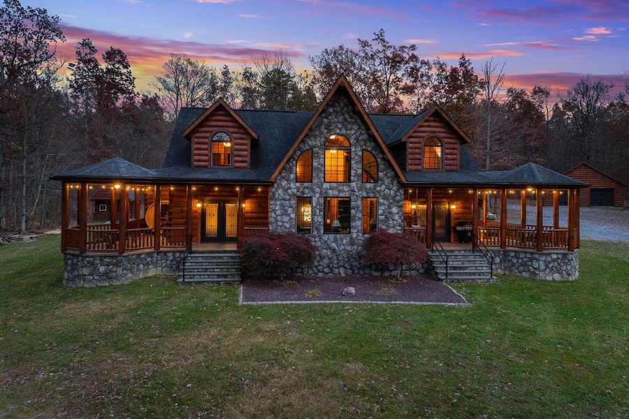 Cabin exterior lit up at dusk